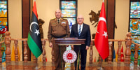 Turkey's Chief of General Staff Gen. Selcuk Bayraktaroglu, right, poses for a photograph with Libyan Chief of General Staff Gen. Mohamed Ali Ahmed El Haddad during their meeting in Ankara, Turkey